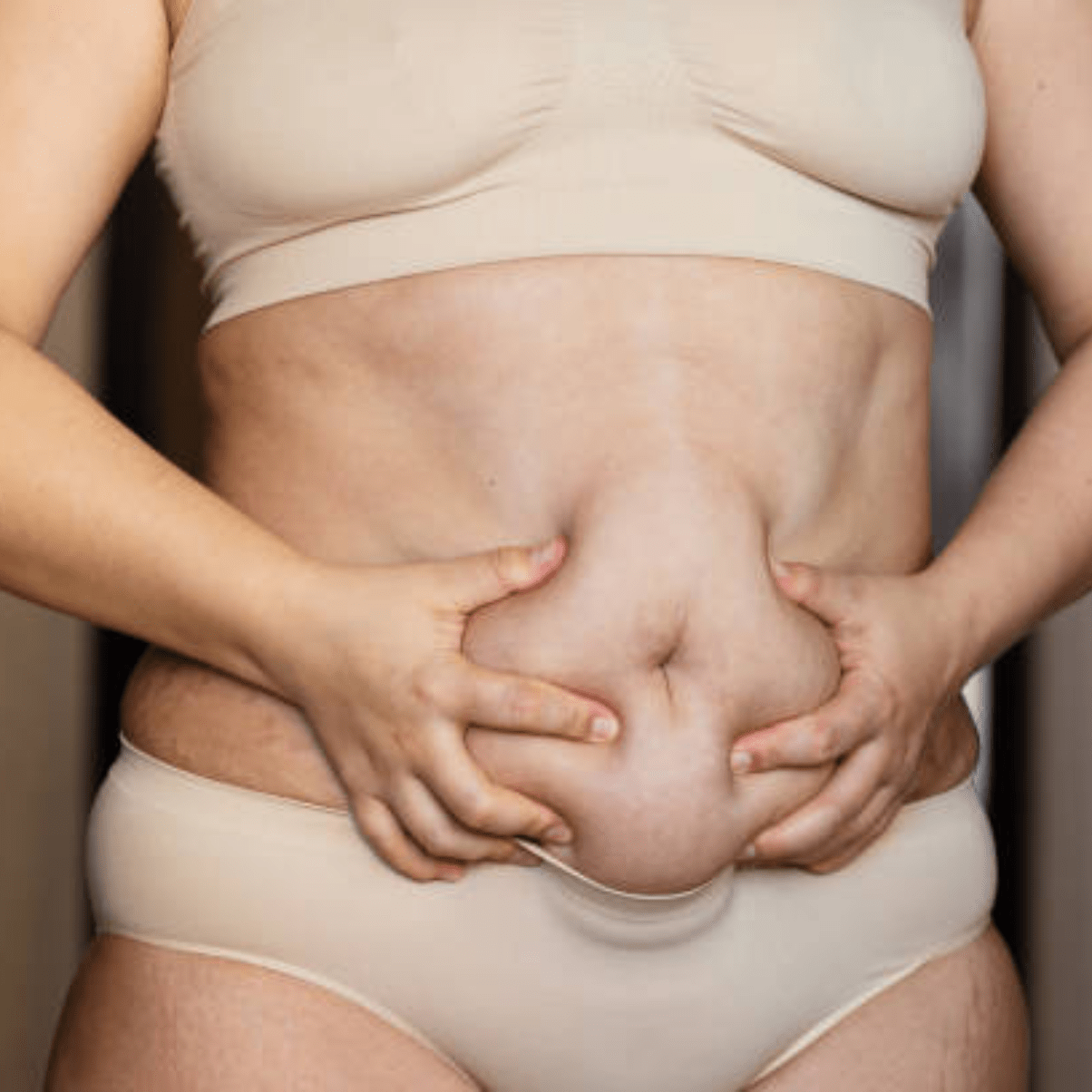 a person holding their stomach with their hands