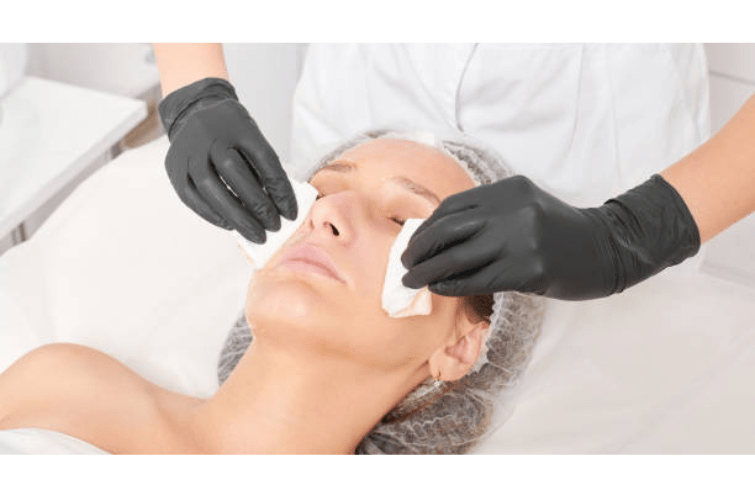 a woman getting her sunken cheeckbones treated in a beauty salon